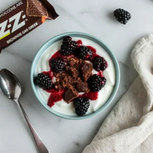 Chocolate Brownie Z-Bar crumbled over yogurt with berries.