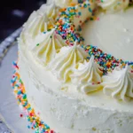 Slicing into a frosted homemade ice cream cake